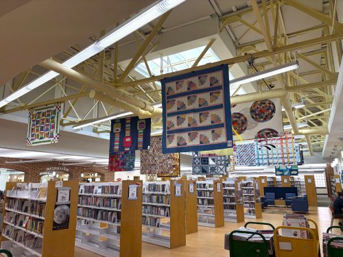 Library with quilts hanging